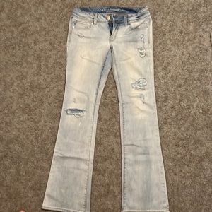 American Eagle light wash distressed boot cut jeans